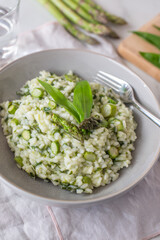 Spring food; Delicious risotto with asparagus and wild garlic