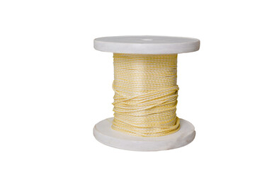 A spool with decorative white threads. Twisted rope. Close-up. On the background. Isolate. Place for an inscription.