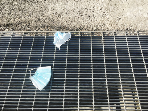 High Angle View Of Surgical Mask On Road