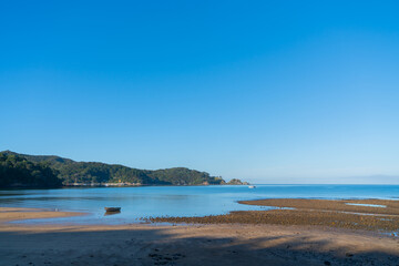 Beautiful blue sky and water at Mulberry Grove Beach on Great Barrier.