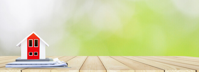 ็House model on wood table green background design wood copy spec