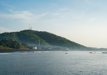 Beautiful view of the tribuana harbor with hills and morning sun