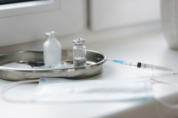 Covid-19 drug vaccine vials medicine bottles syringe injection. Corona Virus infection. Medical...