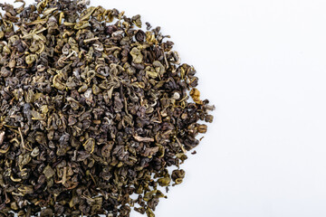 Green tea with jasmine on white background. Top view. Close up. High resolution
