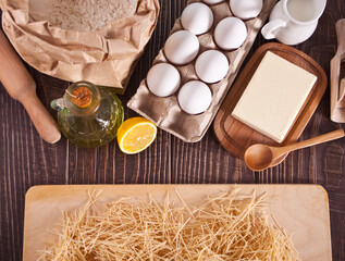Ingredients for home noodles, kitchen utensil on the wooden background. Top view