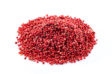 Spice. Pink pepper. Heap of pink peppercorns on a white background. Spicy spice.