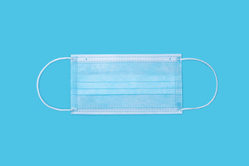 Medical protective mask on blue background. 