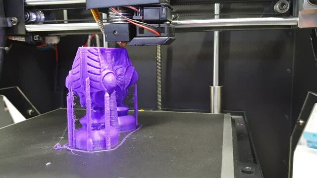 3D printing closeup. 3D printing machine in operation, creates plastic construction