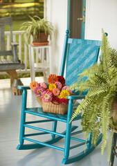 Basket of Flowers and Rocking chair on Porch.