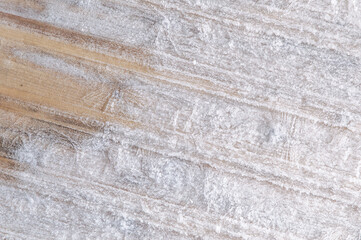 winter frosty background: boards covered with snowflakes and hoarfrost, ice patterns, wood texture, close, toning