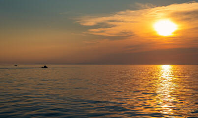 Incredible sunset at sea with calm water. Inspirational background