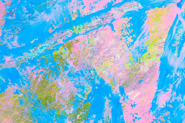 colorful creative motley background: smudged residues of oil paints on a wooden palette, short focus, selective blur