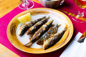 Roasted sardines with lemon, popular spanish dish