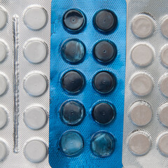 Silver and blue blister packs with tablets Background image