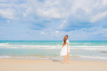 Portrait beautiful young asian woman relax smile leisure around beach sea ocean