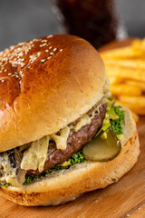 Cheeseburger with eggplant. french fries and coke.