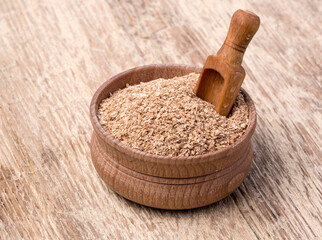 wheat bran in a small wooden bowl