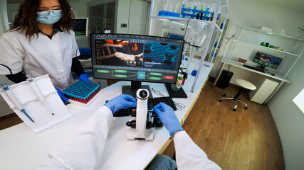 FPV of biotechnology scientist researching in laboratory using microscope analysing various bacteria. Chemist examining virus evolution using high tech for scientific research of vaccine development