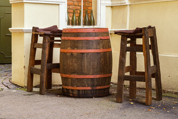 Vintage cafe terrace. Old barrels used as furniture