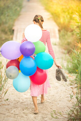 Young woman with balloons  early in the morning © PEPPERSMINT