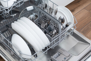 Full load dishwashing machine. Clean dishes and cutlery