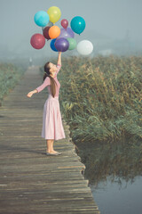 Young woman with balloons  early in the morning © PEPPERSMINT