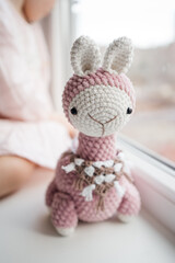 close up shot of cozy soft handmade hobby knitted toy 