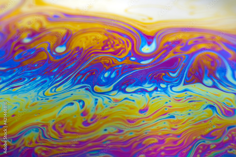 Wall mural colorful psychedelic soap bubble refractions pattern macro. colorful macro soap bubble iridescence