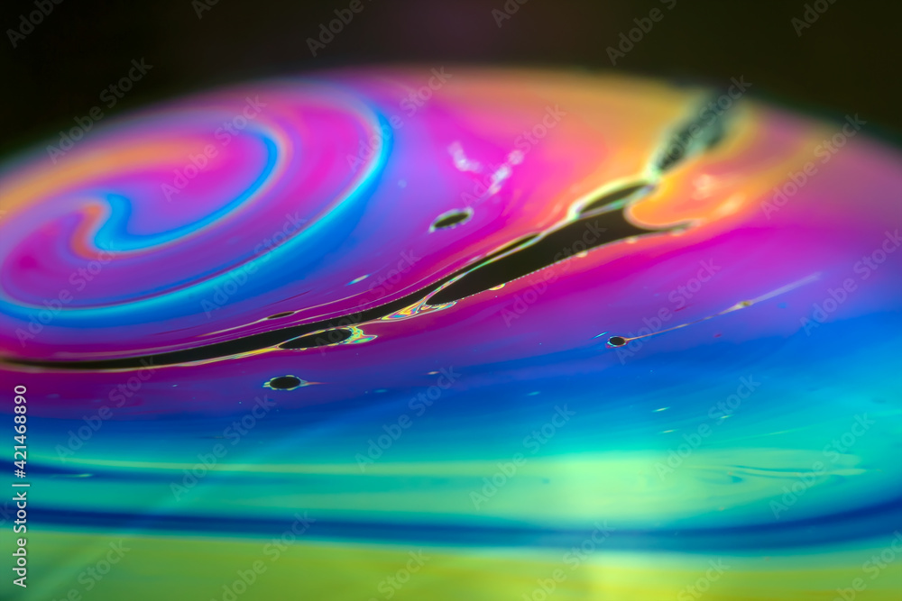 Wall mural colorful psychedelic soap bubble refractions pattern macro. colorful macro soap bubble iridescence