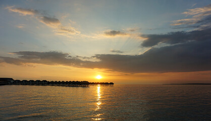 Beautiful cloudy sunset in Bagan Lalang beach, Selangor, Malaysia.