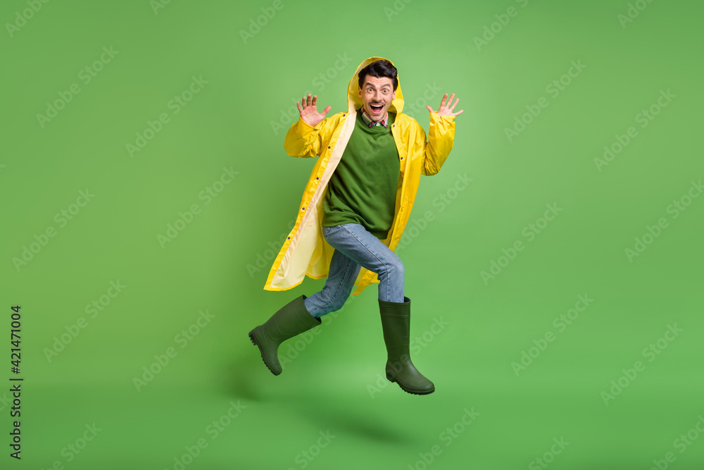 Canvas Prints full length body size view of attractive cheerful crazy guy wearing raincoat jumping having fun runn