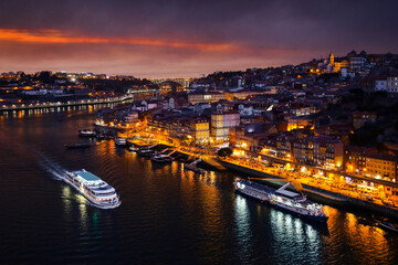 Porto at dusk. View of the center of Porto and the Duoro River at night against a sunset