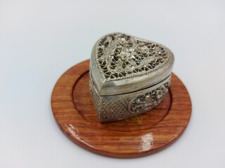 Vintage soviet silver box on wooden plate on white background