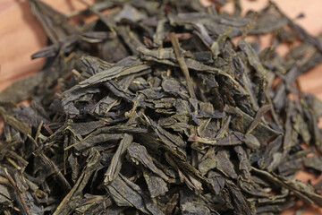 Green tea dried and rolled leaves