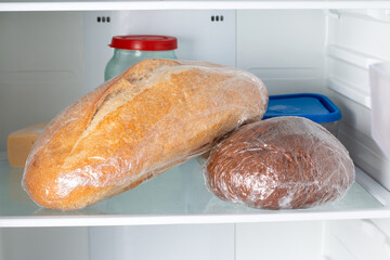 Frozen bread in the home refrigerator. The frozen products. Long food storage concept.