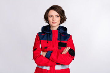 Photo of young woman paramedic serious confident crossed hands wear uniform isolated over white...