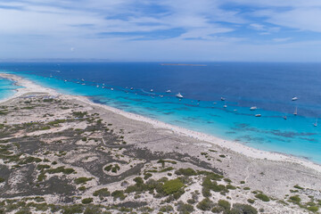Fototapeta na wymiar Amazing aerial of Formentera the Maldives of Europe with lots of boats and yachts in Ibiza Spain
