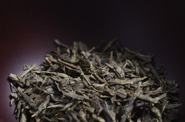 Green tea dried and rolled leaves