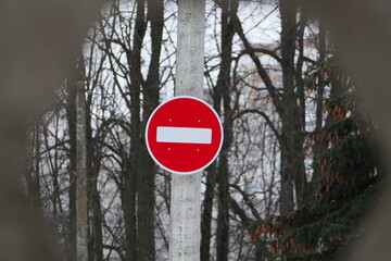 A road sign on a pole. Passage is forbidden, round