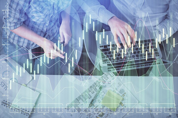 Multi exposure of man and woman working together and forex graph hologram drawing. Financial...