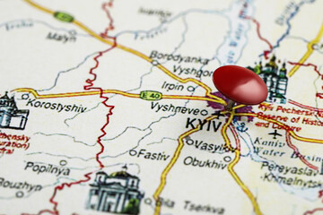 Naklejka premium MYKOLAIV, UKRAINE - NOVEMBER 09, 2020: Kyiv city marked with push pin on map of Ukraine, closeup