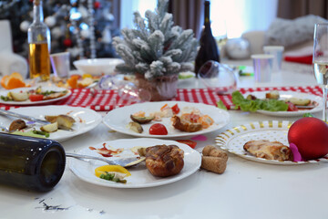 Dirty dishes on white table in room. Mess after new year party