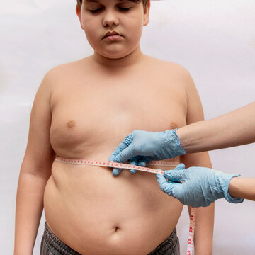 A child with an overweight problem. Measurement of body volume.