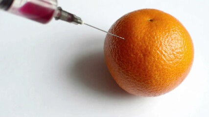 GMO injection with syringe in Orange