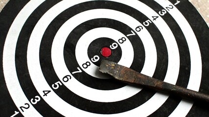 rotating dart board with broken arrow