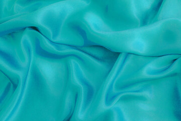 ,Silver silk background. Blue.Folds.