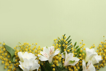 Beautiful floral composition with mimosa flowers on green background, flat lay. Space for text