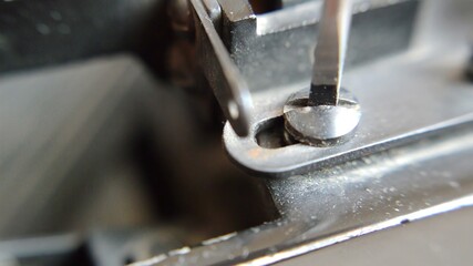 unscrews screw by screwdriver of my old typewriter