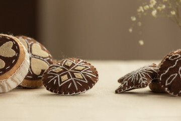 Handmade felt cookies with chocolate are on a beige background. The concept of a romantic gift for Valentine's Day, a greeting card for mothers. Felt game food, soft sweets for pretend food.