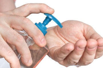 Man is applying antibacterial gel, sanitiser on his hands